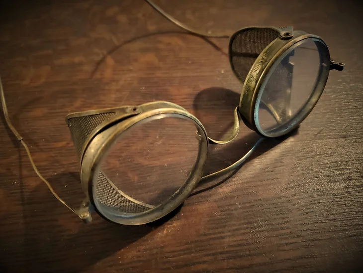 Old School style glasses on a wooden table.